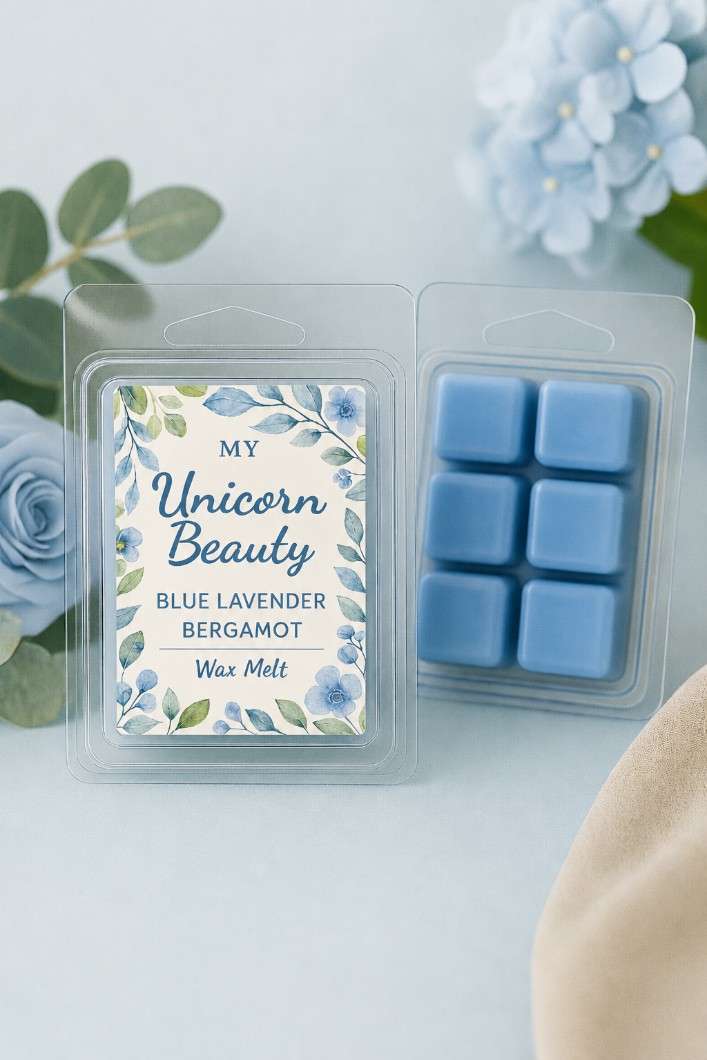 Wax melt package labeled 'My Unicorn Beauty' with blue lavender bergamot scent, surrounded by flowers.