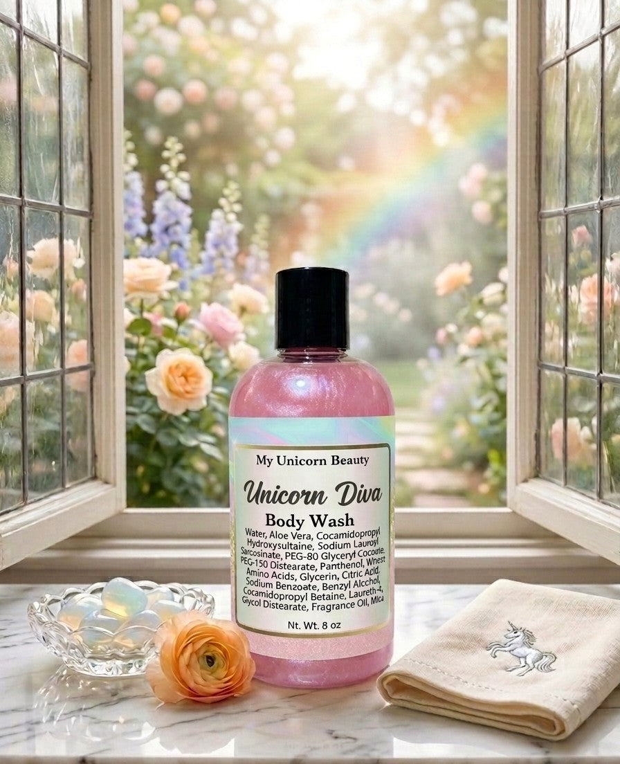 Bottle of 'Unicorn Diva' body wash on a windowsill with flowers and a rainbow outside.