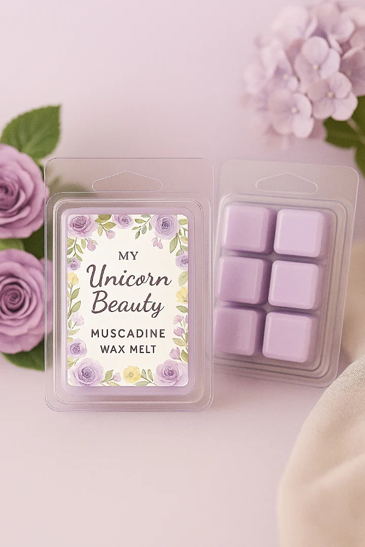Wax melt packaging with floral design and text on a light pink background with flowers.