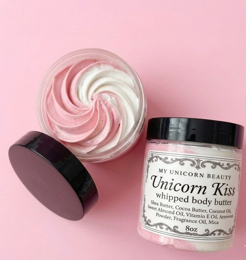 Unicorn Kiss whipped body butter jar with pink and white swirls on a pink background