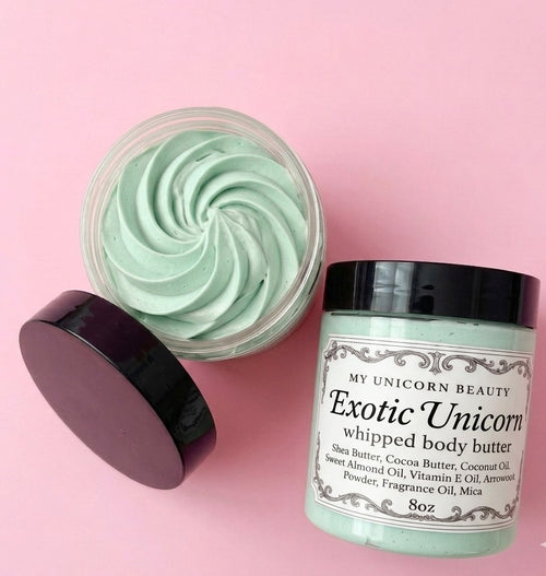 Exotic Unicorn whipped body butter jar with lid on a pink background