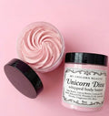 Unicorn Diva whipped body butter jar with pink cream on a pink background